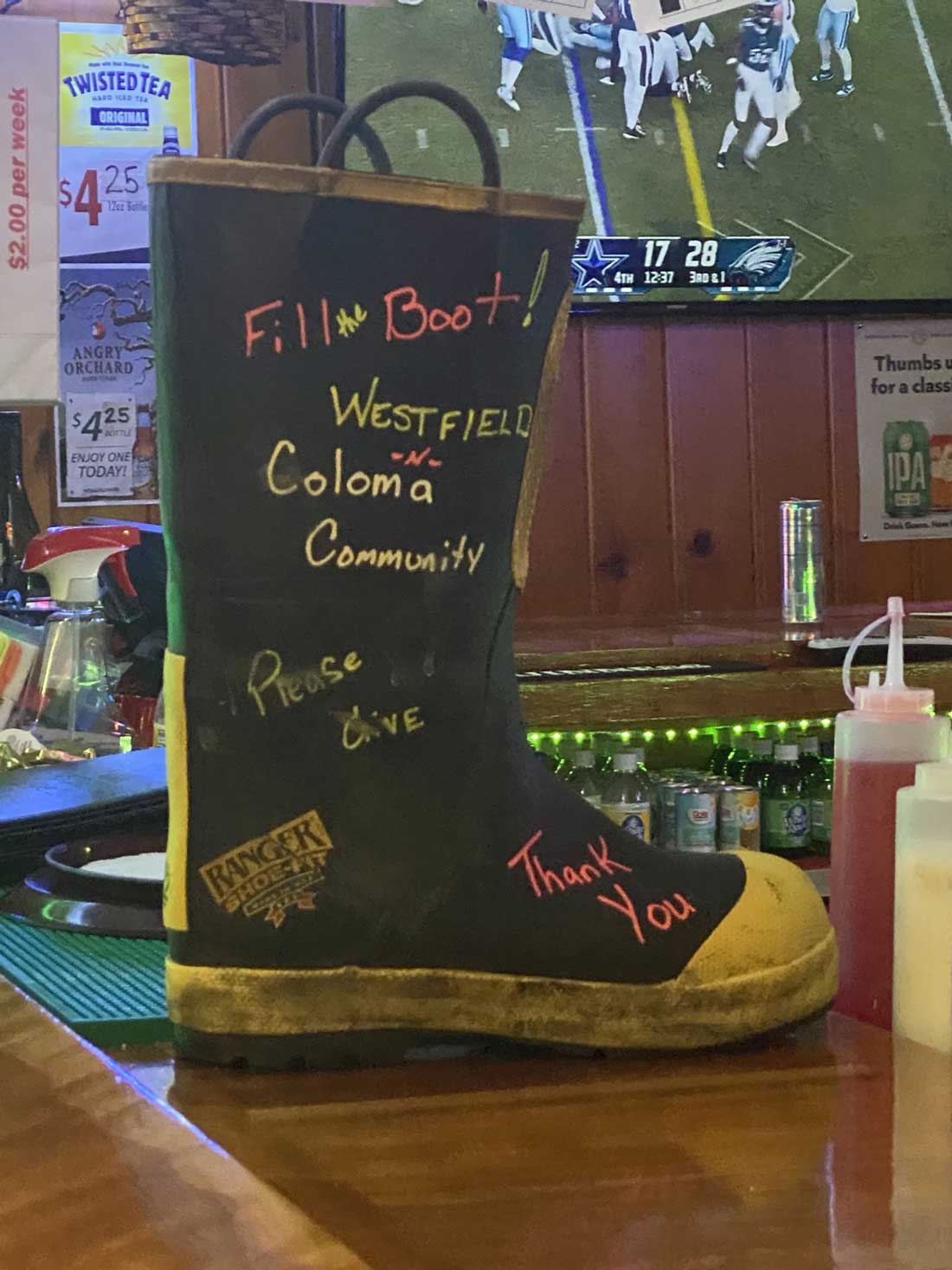 Crystal's Wood Lake Supper Club Westfield, WI restaurant bar fill the firefighter boot donation drive